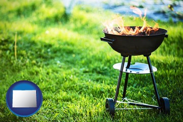a round barbecue grill - with Colorado icon