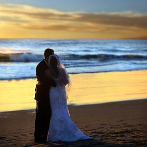 a beach wedding at sunset