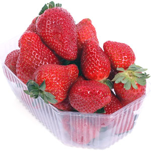 a transparent plastic box filled with red strawberries