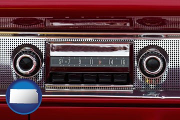 a vintage car radio - with Kansas icon