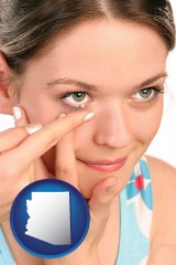 arizona map icon and a young woman inserting a contact lens