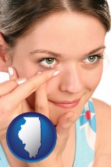 illinois map icon and a young woman inserting a contact lens