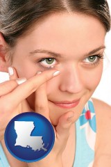 louisiana map icon and a young woman inserting a contact lens