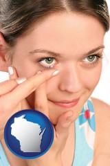 wisconsin map icon and a young woman inserting a contact lens