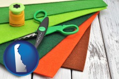delaware map icon and craft supplies (colorful felt and a pair of scissors)