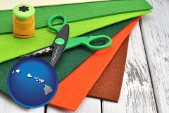 hawaii map icon and craft supplies (colorful felt and a pair of scissors)