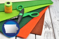 iowa map icon and craft supplies (colorful felt and a pair of scissors)