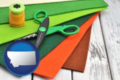 montana map icon and craft supplies (colorful felt and a pair of scissors)