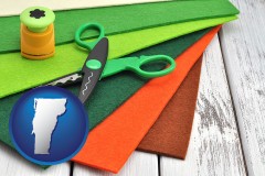 vermont map icon and craft supplies (colorful felt and a pair of scissors)