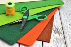 craft supplies (colorful felt and a pair of scissors)
