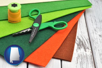craft supplies (colorful felt and a pair of scissors) - with Alabama icon