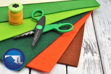 craft supplies (colorful felt and a pair of scissors) - with Maryland icon