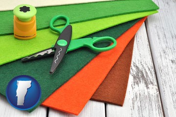 craft supplies (colorful felt and a pair of scissors) - with Vermont icon