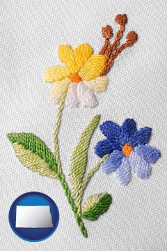 hand-embroidered needlework - with North Dakota icon