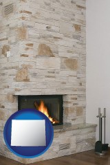wyoming map icon and a limestone fireplace