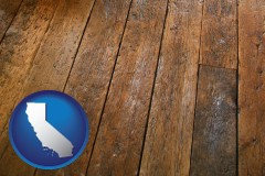 california map icon and a distressed wood floor