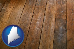maine map icon and a distressed wood floor