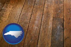 north-carolina map icon and a distressed wood floor