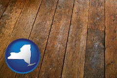 new-york map icon and a distressed wood floor