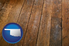 oklahoma map icon and a distressed wood floor