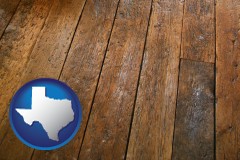 texas map icon and a distressed wood floor