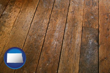 a distressed wood floor - with North Dakota icon