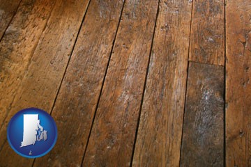 a distressed wood floor - with Rhode Island icon