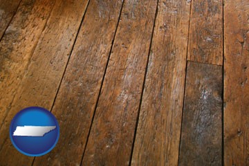 a distressed wood floor - with Tennessee icon