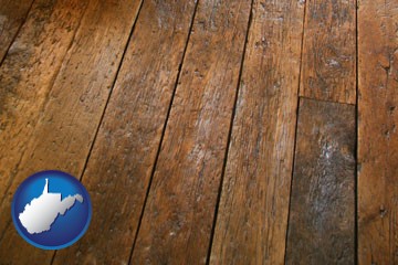 a distressed wood floor - with West Virginia icon