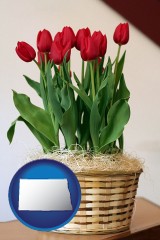 north-dakota map icon and a gift basket with red tulips