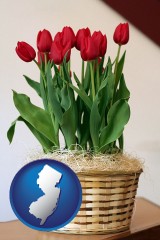 new-jersey map icon and a gift basket with red tulips
