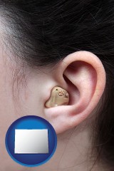 colorado a woman wearing a hearing aid in her left ear