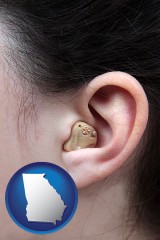 georgia map icon and a woman wearing a hearing aid in her left ear