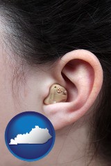 kentucky map icon and a woman wearing a hearing aid in her left ear