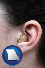 missouri map icon and a woman wearing a hearing aid in her left ear