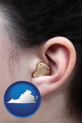 virginia map icon and a woman wearing a hearing aid in her left ear