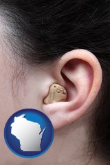 wisconsin map icon and a woman wearing a hearing aid in her left ear
