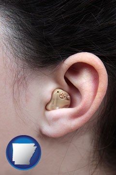 a woman wearing a hearing aid in her left ear - with Arkansas icon
