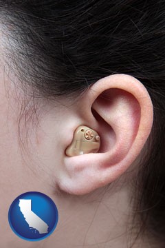 a woman wearing a hearing aid in her left ear - with California icon