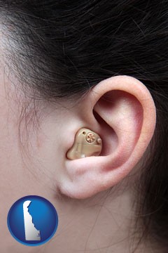 a woman wearing a hearing aid in her left ear - with Delaware icon