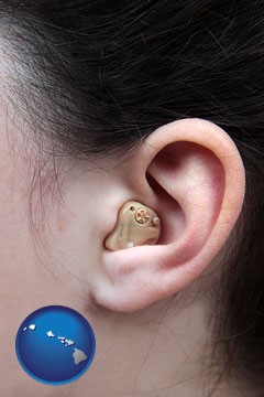 a woman wearing a hearing aid in her left ear - with Hawaii icon