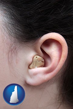 a woman wearing a hearing aid in her left ear - with New Hampshire icon