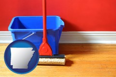 arkansas a bucket and mop on a hardwood floor
