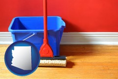 arizona map icon and a bucket and mop on a hardwood floor