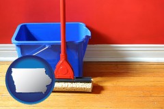 iowa a bucket and mop on a hardwood floor