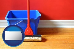 kansas map icon and a bucket and mop on a hardwood floor