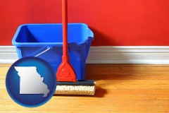 missouri map icon and a bucket and mop on a hardwood floor