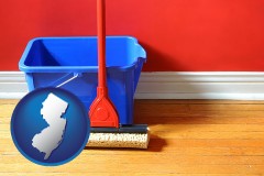 new-jersey map icon and a bucket and mop on a hardwood floor