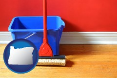 oregon a bucket and mop on a hardwood floor