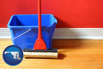 a bucket and mop on a hardwood floor - with Maryland icon